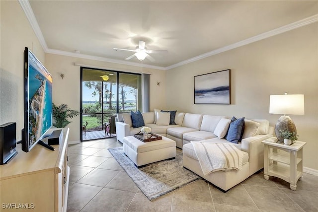 living room with baseboards, light tile patterned flooring, a ceiling fan, and crown molding