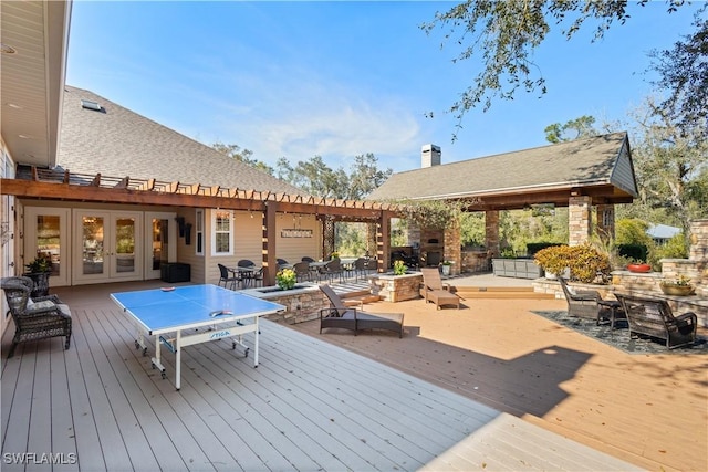 wooden deck featuring french doors