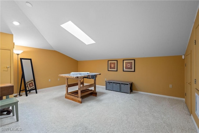 rec room featuring light carpet and lofted ceiling with skylight