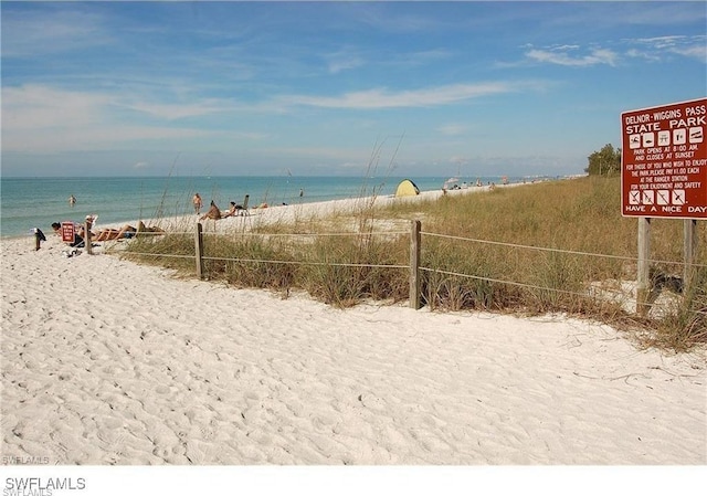 property view of water featuring a beach view