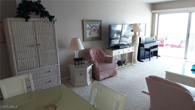 sitting room featuring light colored carpet