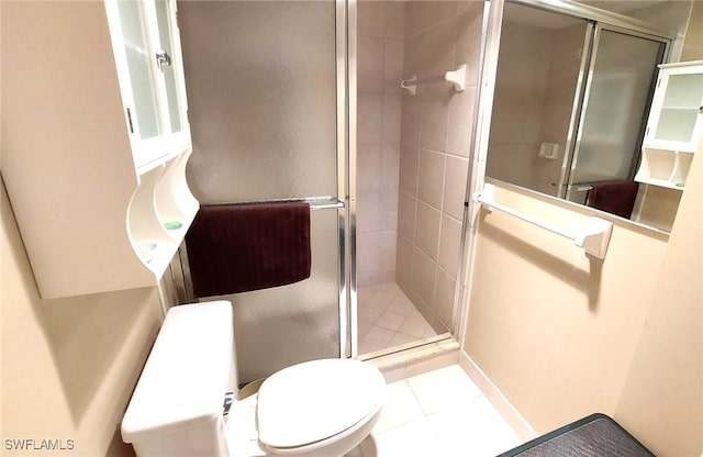 bathroom with an enclosed shower and toilet