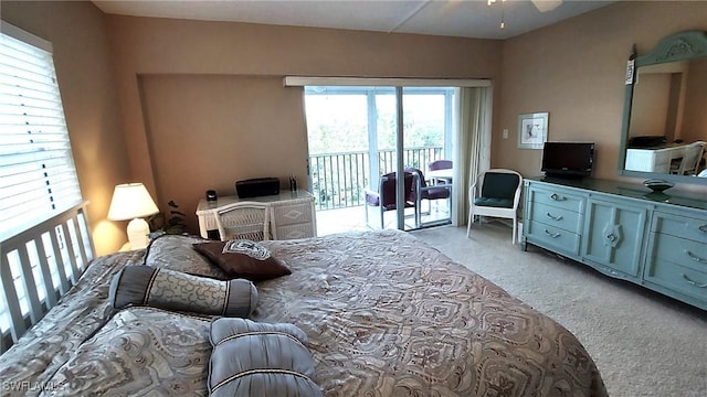 bedroom featuring light carpet and access to exterior