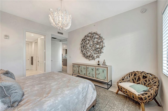 bedroom featuring an inviting chandelier