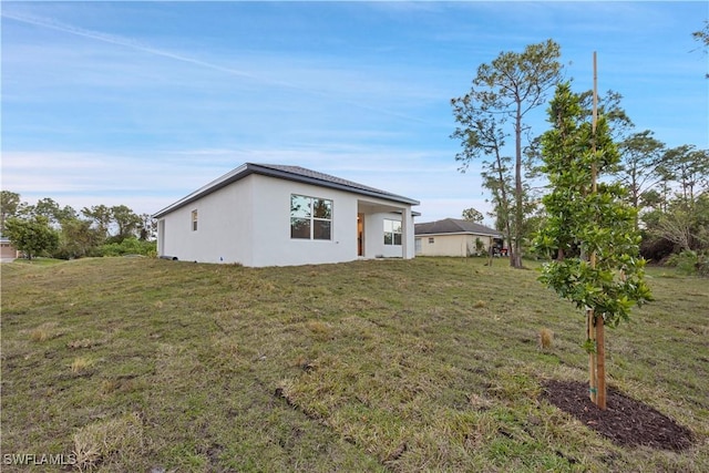 exterior space featuring a front yard