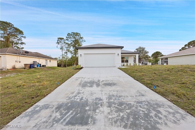 ranch-style home featuring a front lawn and a garage