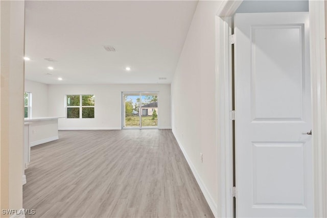 unfurnished living room with light wood-type flooring