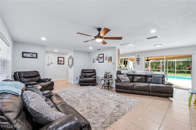 tiled living room featuring ceiling fan