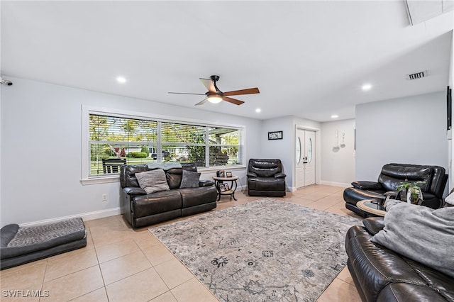 tiled living room with ceiling fan