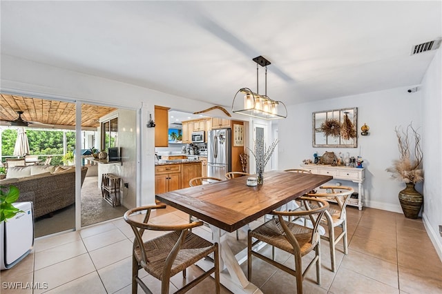 dining area featuring light tile patterned floors