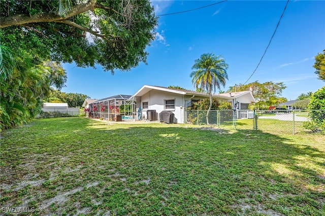 view of yard featuring a lanai