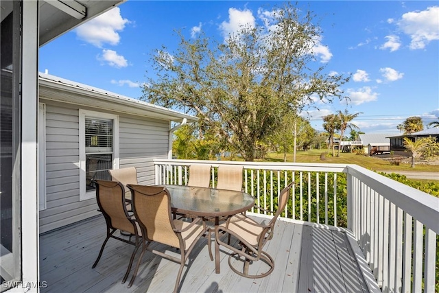 deck with outdoor dining area