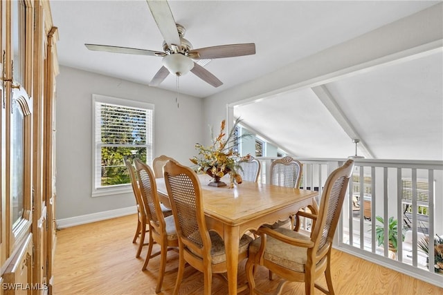 dining room featuring light wood finished floors, ceiling fan, and baseboards