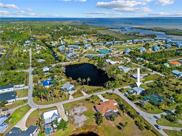 birds eye view of property featuring a residential view and a water view