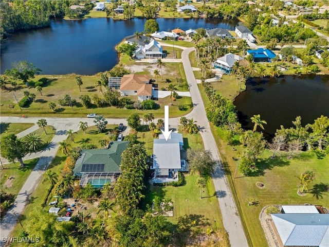 bird's eye view with a residential view and a water view