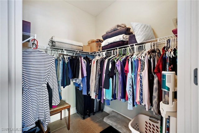 walk in closet with tile patterned flooring