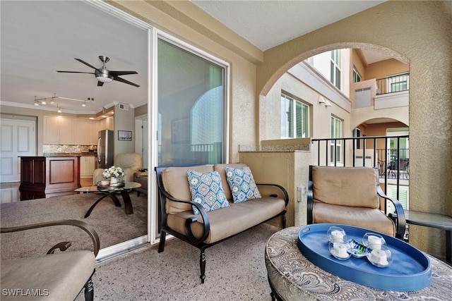 balcony featuring ceiling fan and outdoor lounge area