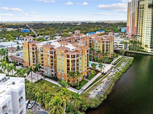 birds eye view of property with a water view