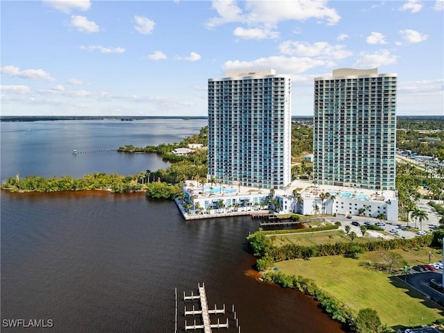 birds eye view of property with a water view