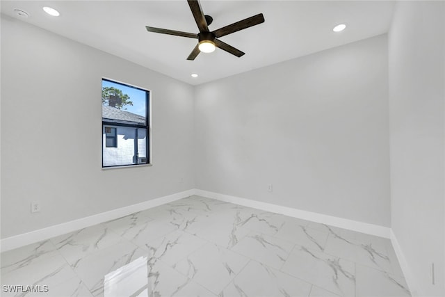 spare room featuring ceiling fan, recessed lighting, and baseboards