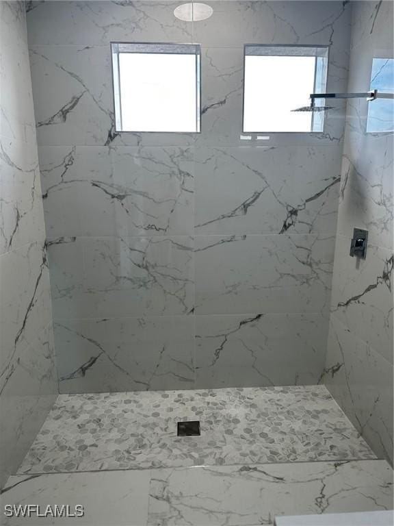 2610 34th St SW, Lehigh Acres, FL 33976 - bathroom featuring a marble finish shower