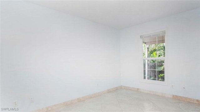 empty room featuring light tile patterned floors