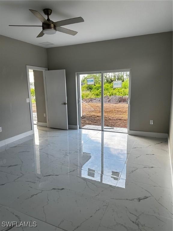 unfurnished room with ceiling fan