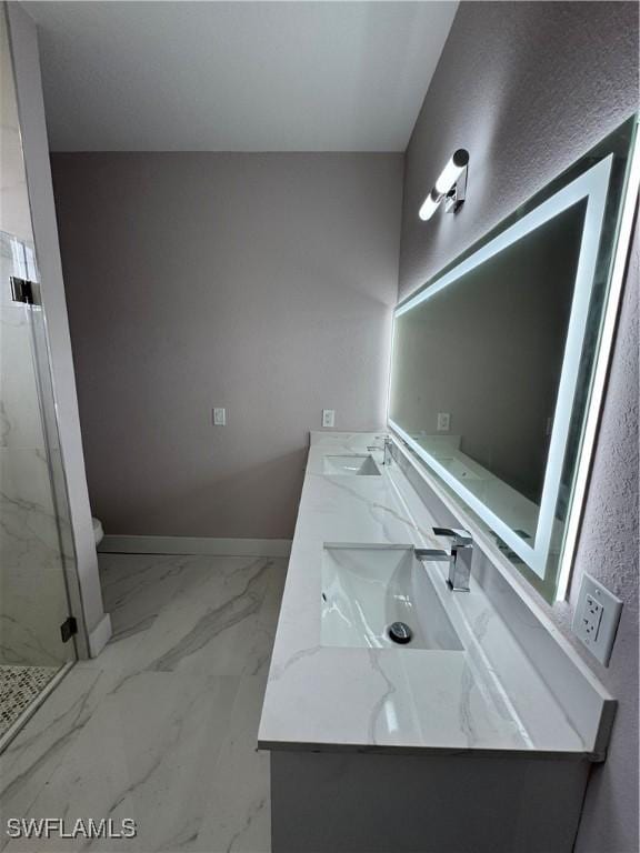 2810 27th St SW, Lehigh Acres, FL 33976 - full bathroom featuring double vanity, a marble finish shower, toilet, marble look tiles, and baseboards
