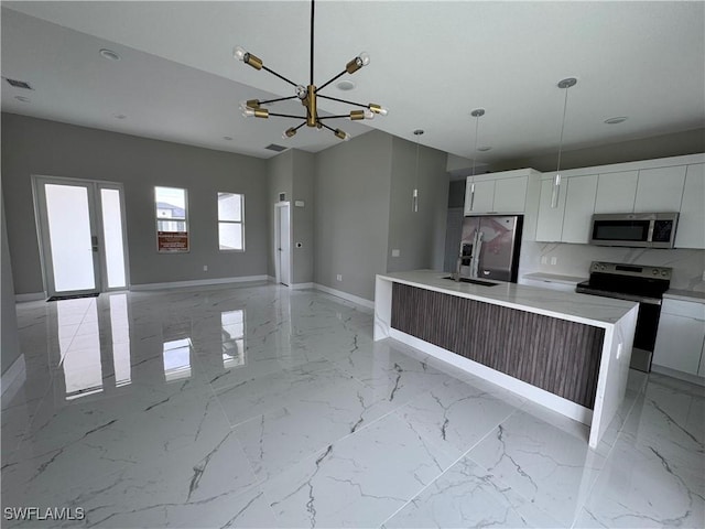 2713 26th St SW, Lehigh Acres, FL 33976 - kitchen featuring appliances with stainless steel finishes, modern cabinets, white cabinetry, and baseboards