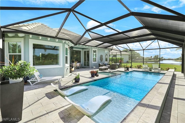 outdoor pool with glass enclosure, a patio area, and an outdoor living space