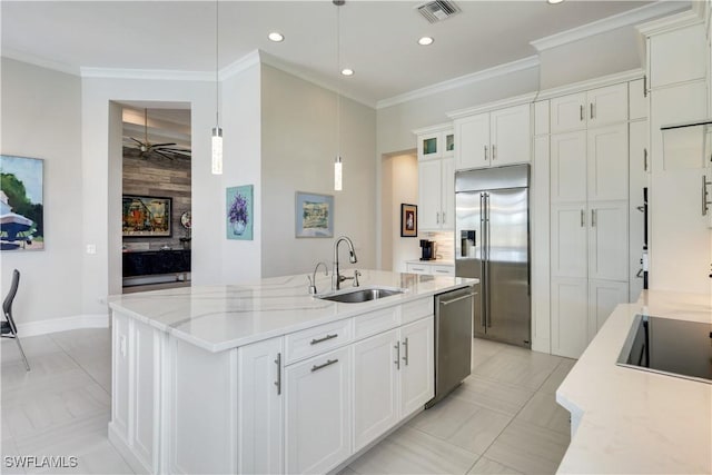 kitchen with visible vents, appliances with stainless steel finishes, white cabinetry, pendant lighting, and a sink