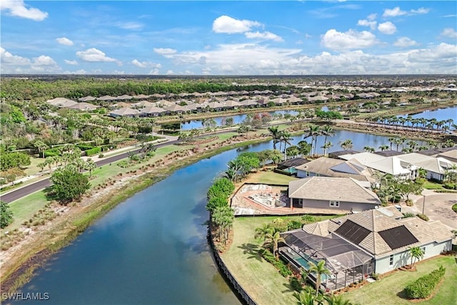 birds eye view of property featuring a water view and a residential view