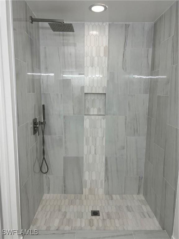 bathroom with tiled shower