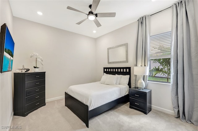 bedroom with light carpet and ceiling fan