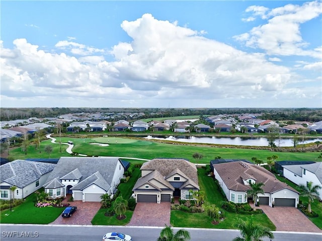 drone / aerial view with a water view and a residential view