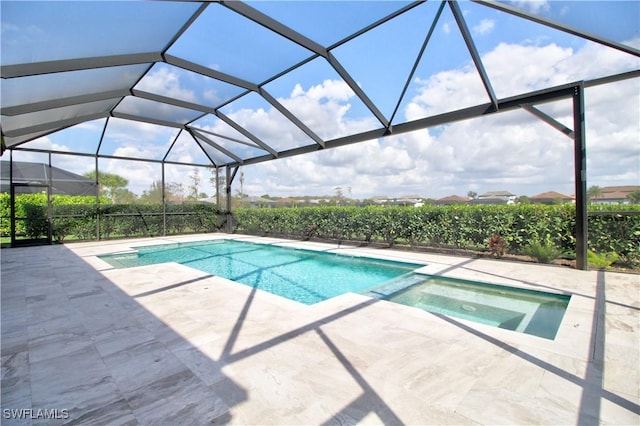 view of pool featuring a lanai and a patio area