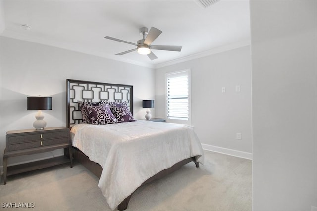 bedroom featuring ceiling fan, crown molding, and light carpet