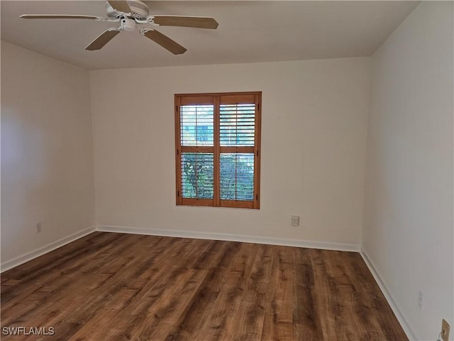 unfurnished room with dark wood-type flooring and ceiling fan