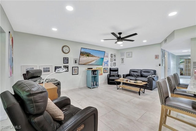 living room featuring ceiling fan, visible vents, baseboards, and recessed lighting