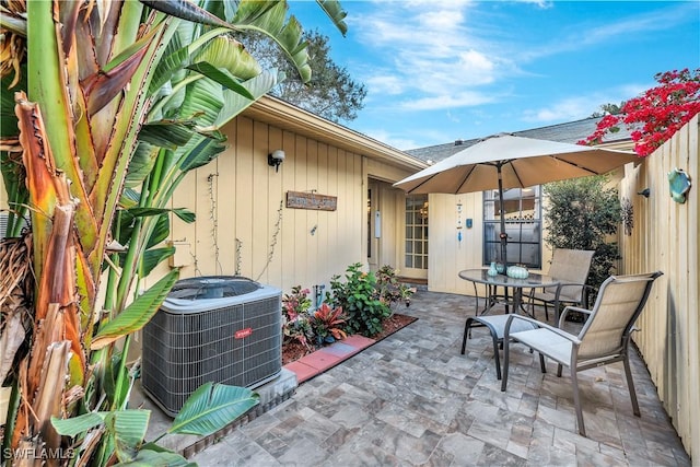 view of patio / terrace with fence and central AC