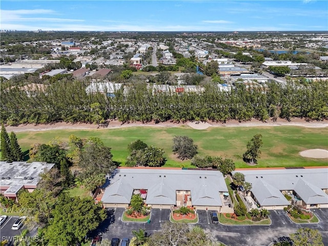 bird's eye view with view of golf course and a residential view