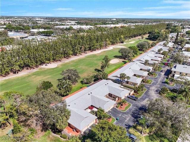 birds eye view of property with a residential view and view of golf course