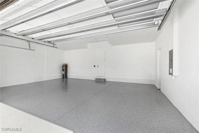 garage with electric panel and water heater