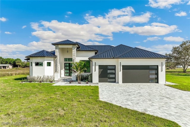 contemporary home featuring metal roof, an attached garage, a standing seam roof, decorative driveway, and stucco siding