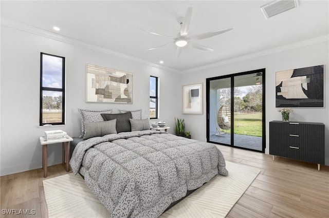 bedroom with light wood-type flooring, access to outside, visible vents, and ornamental molding