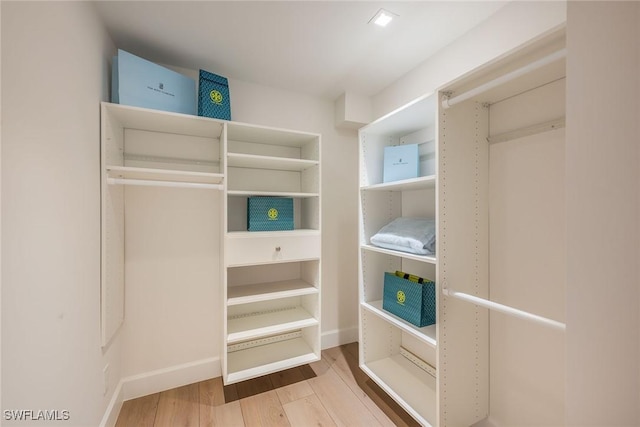 spacious closet with wood finished floors