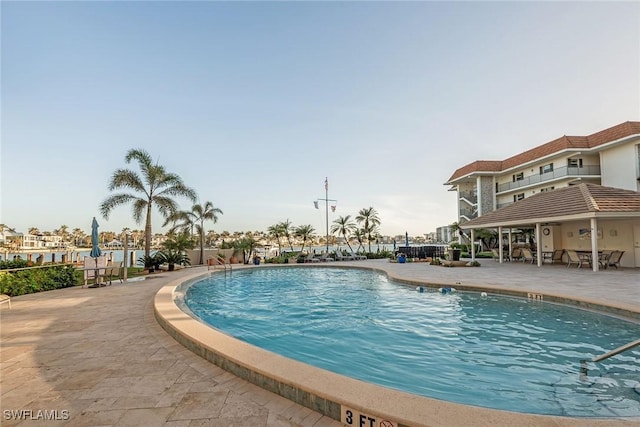 community pool with a patio area