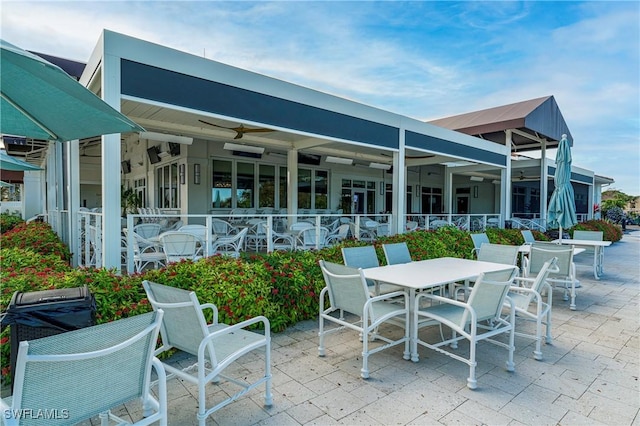 5548 Foxhunt Way, Naples, FL 34104 - view of patio featuring a ceiling fan and outdoor dining area