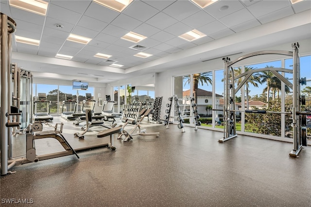 5548 Foxhunt Way, Naples, FL 34104 - gym featuring a paneled ceiling and plenty of natural light