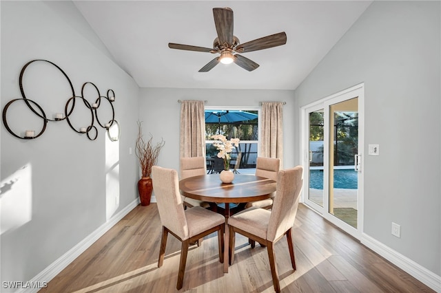 5548 Foxhunt Way, Naples, FL 34104 - dining area featuring vaulted ceiling, wood finished floors, baseboards, and ceiling fan